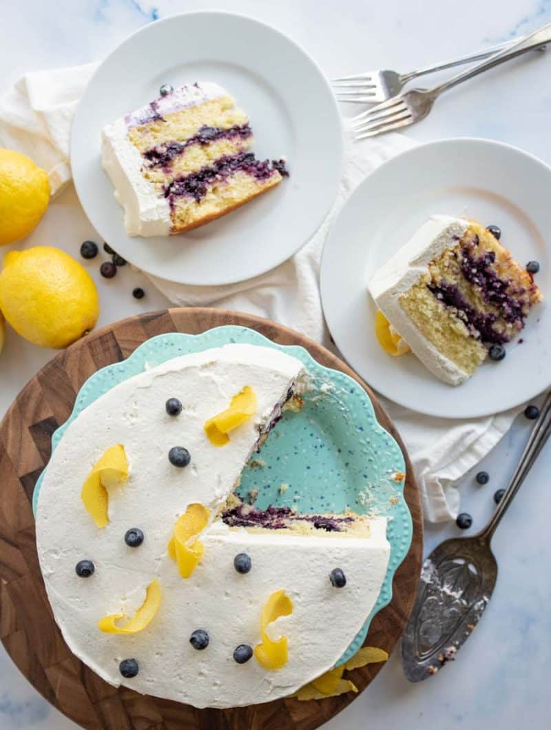 top view of the lemon blueberry cake with two pieces served onto white plates