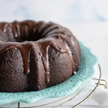 side view of the chocolate bundt cake with dripping ganache down the sides