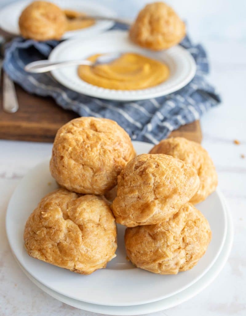 gougeres on a white plate as a side to soup