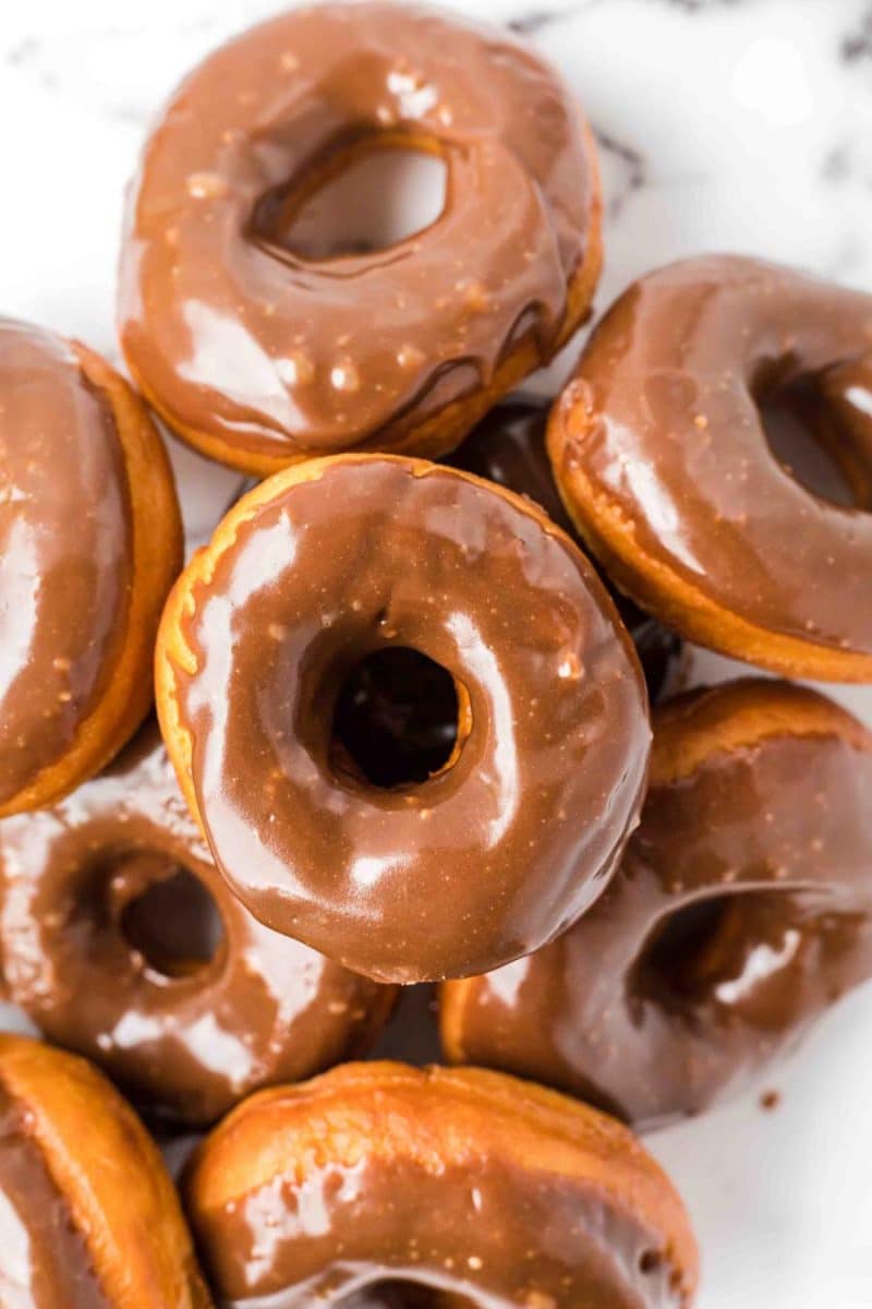 close-up view of chocolate donuts stacked up