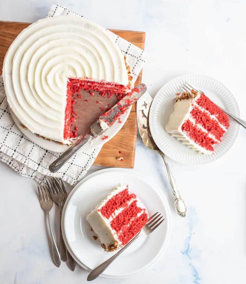Red velvet cake with slices on plates