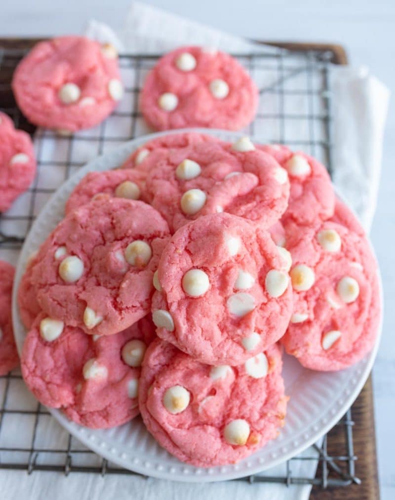 Photo of strawberry cookies stacked on a plate.