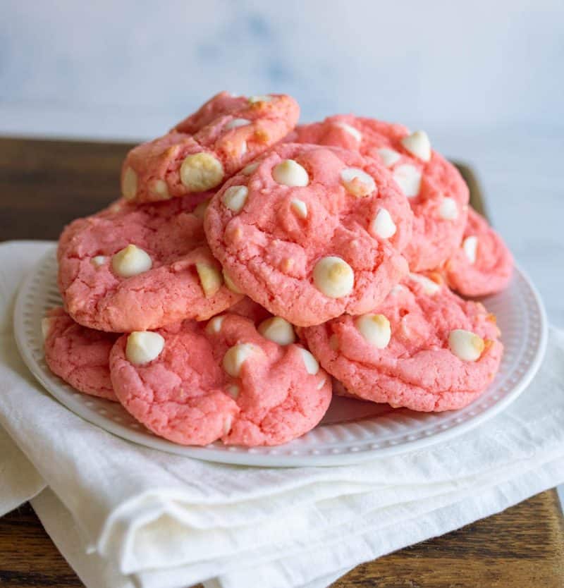 Stack of strawberry cookies on a white plate. 