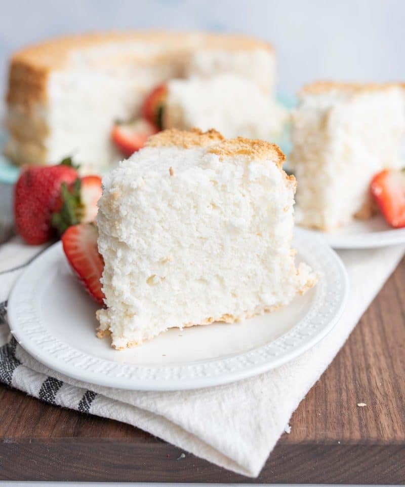 one piece of white fluffy angel food cake on a serving plate