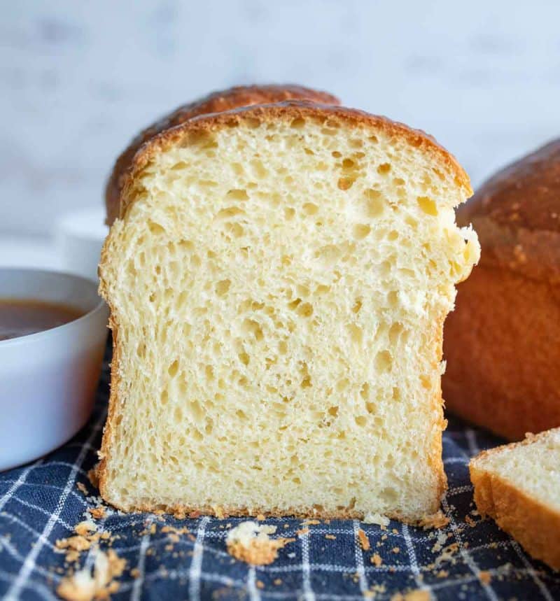 golden brioche bread loafs in half