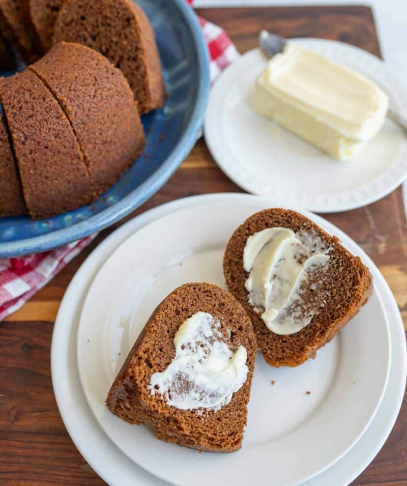 brown bread in a bundt shape sliced and buttered