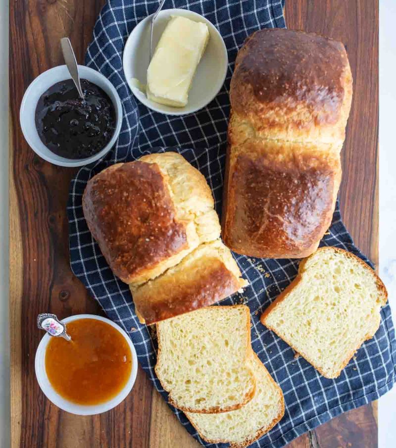 top view aesthetic of brioche bread loaf with butter and jam