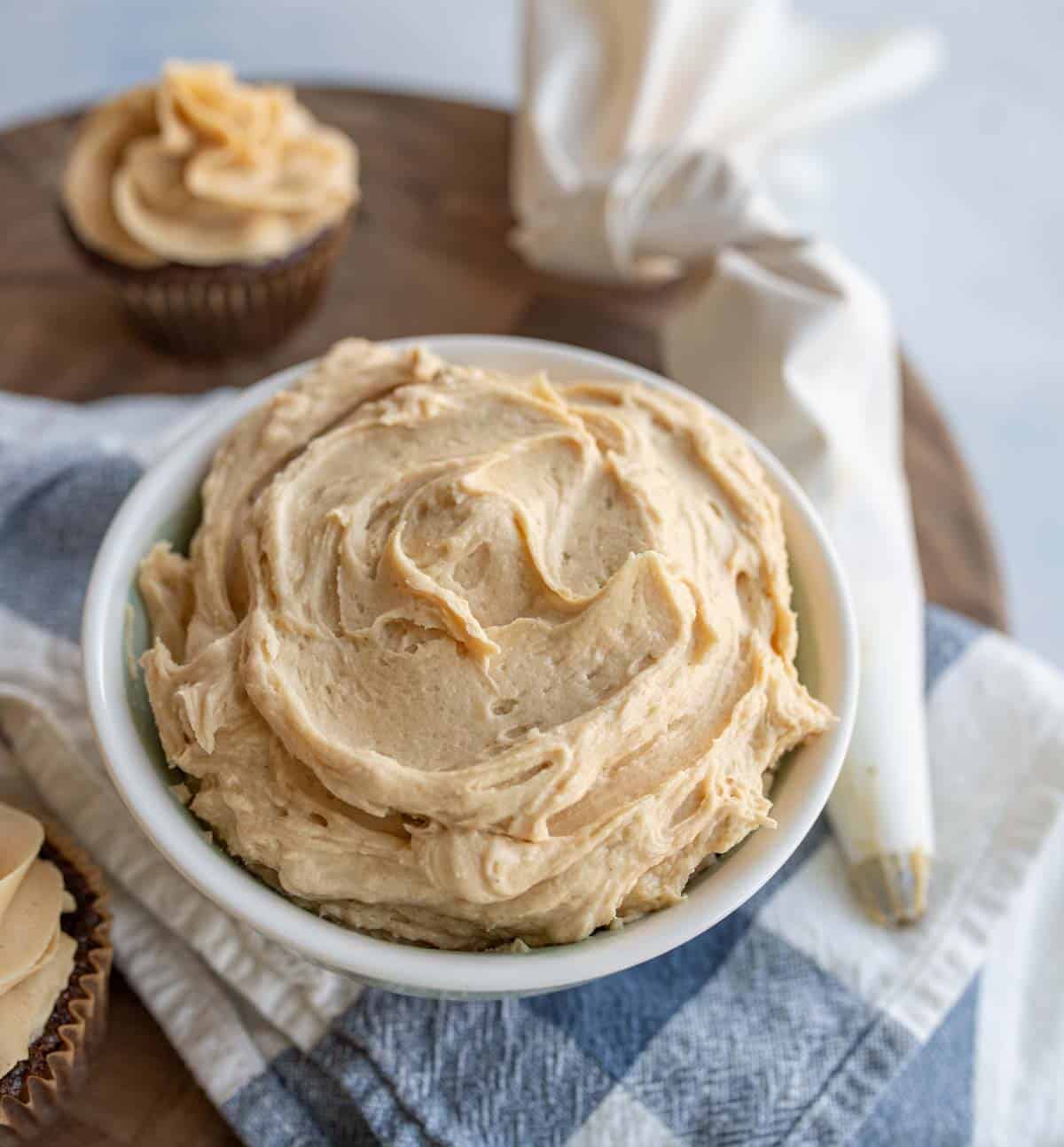 white bowl of peanut butter frosting