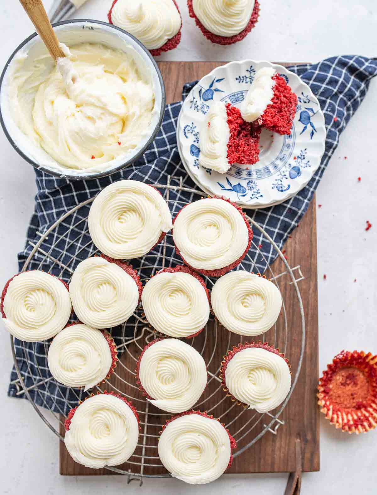 top view aesthetic scene of red velvet cupcakes with cream cheese frosting