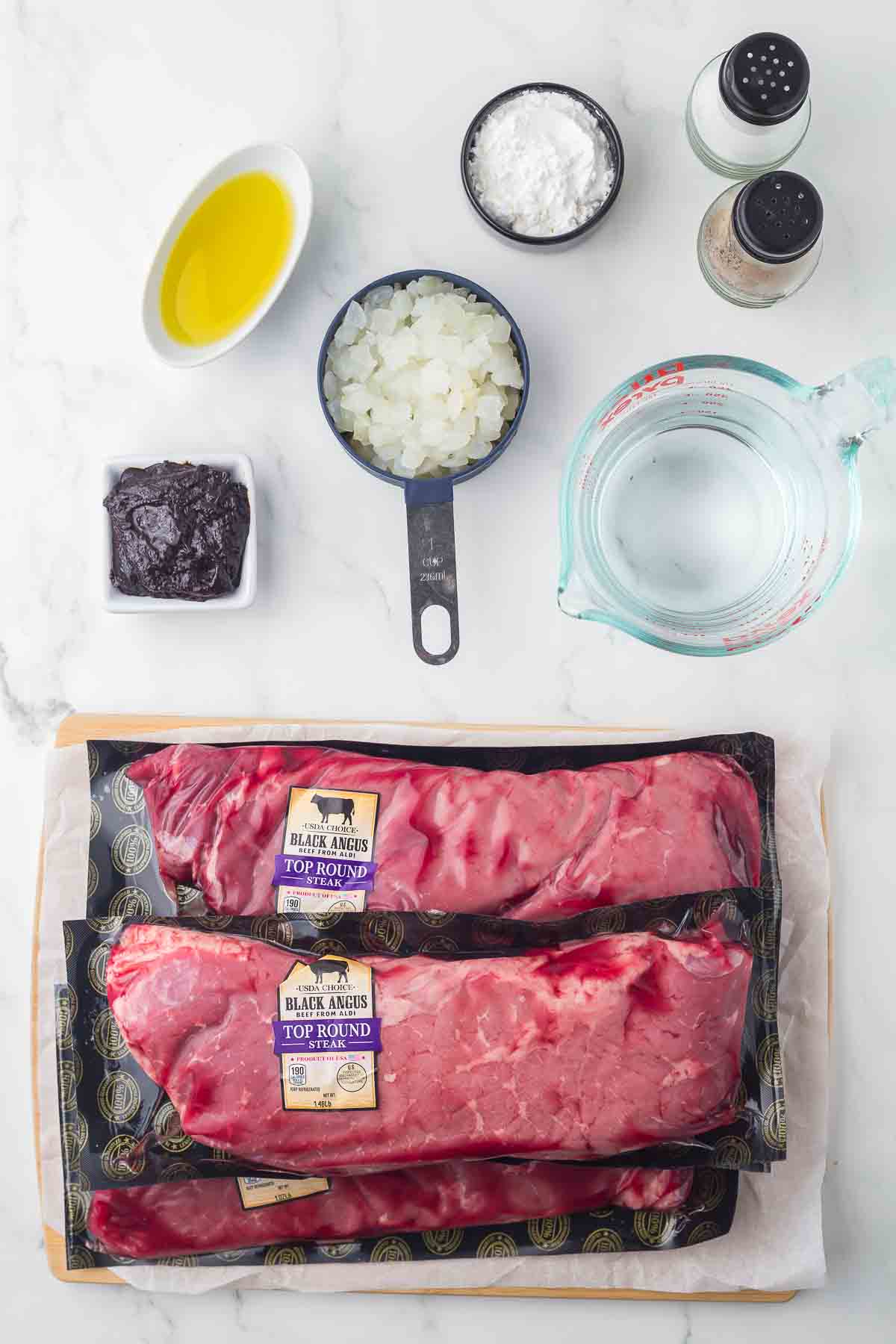 top view of portioned ingredients for round steak recipe