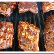 racks of ribs on a char broil outside grill.